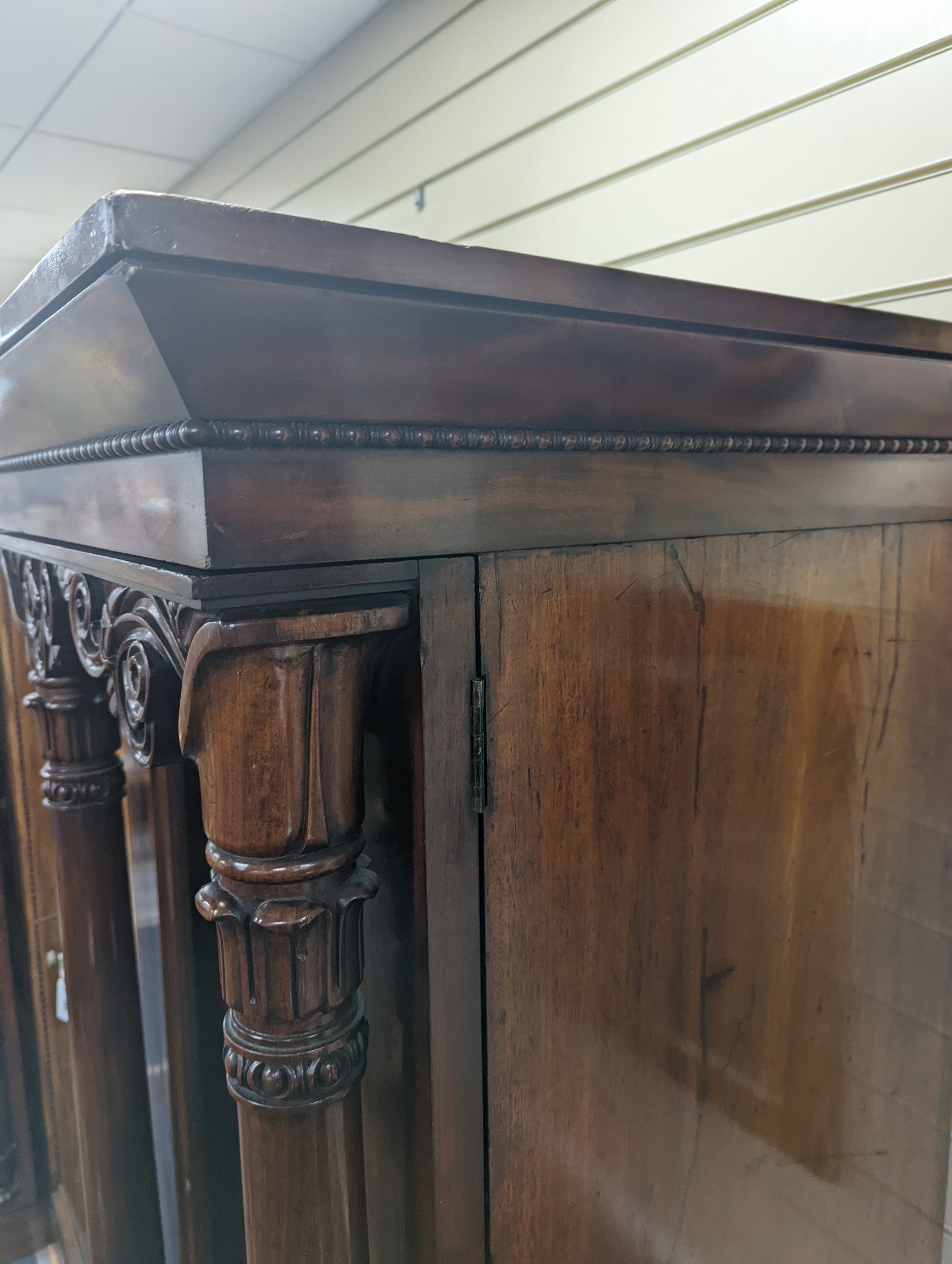 A William IV figured mahogany inverse breakfront compactum wardrobe, length 263cm, depth 70cm, height 197cm